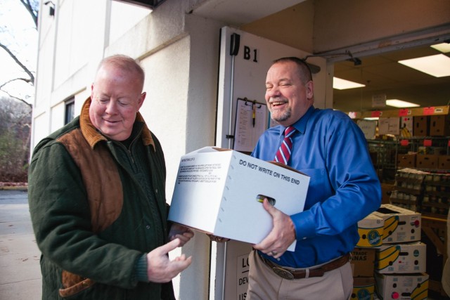 Non-perishable food donation items being dropped off at Loaves & Fishes by USAG Devens RFTA staff.