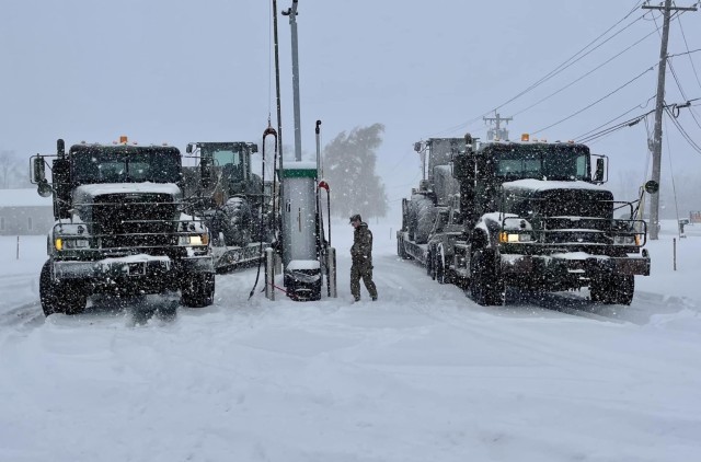 2nd Squadron, 101st Cavalry Regiment prepares their heavy equipment and vehicles before responding to support requests around heavily snowed-in Buffalo, NY, Nov 19, 2022, Niagara Falls Air Reserve Station, Niagara Falls NY. Since being placed on standby at NY Gov Kathy Hochul's direction, the number of activated service members has doubled to 140. Heaviest affected areas are reporting over 6 feet of snow. Courtesy National Guard photo by 2nd Squadron, 101st Cavalry Regiment.