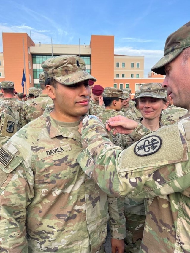 Lt. Alejandro Davila, Public Health Command Europe brigade S1 is being pinned on the Expert Field Me