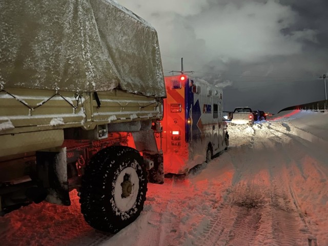 New York National Soldiers from the 2nd Squadron, 101st Cavalry Regiment, help free an EMS vehicle stranded during a snowstorm in Buffalo Nov 19, 2022. Some areas reported over 6 feet of snow.
