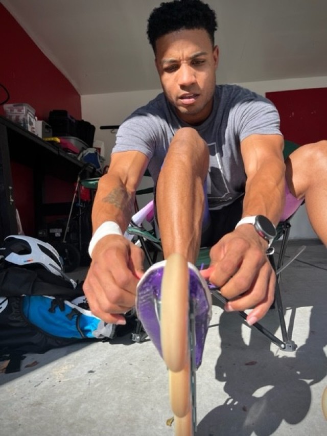 Sgt. 1st Class Markevous Humphrey ties his skates ahead of a training session near Ft. Bragg, North Carolina on Oct. 5, 2022.  Humphrey is preparing to compete in the World Skate Roller Games in Buenos Aires, Argentina.