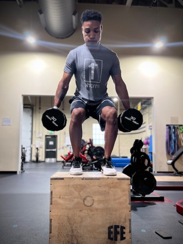 Sgt. 1st Class Markevous Humphrey performs box jumps with weights during a training session near Ft. Bragg, North Carolina on Oct. 5, 2022.  Humphrey is preparing to compete at the World Skate Roller Games in Buenos Aires, Argentina.