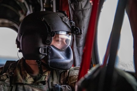 U.S. Army Spc. Shane Sutton, a CH-47 Chinook crew chief assigned to the 2nd Battalion, 501st Aviation Regiment, 1st Combat Aviation Brigade, 1st Armored Division observes the terrain outside of the aircraft before landing during a live fire exercise at Drawsko Pomorski, Poland, Oct. 18, 2022. The unit is among others proudly working alongside NATO allies and regional security partners to provide combat-credible forces to V Corps, America&#39;s forward deployed corps in Europe.
