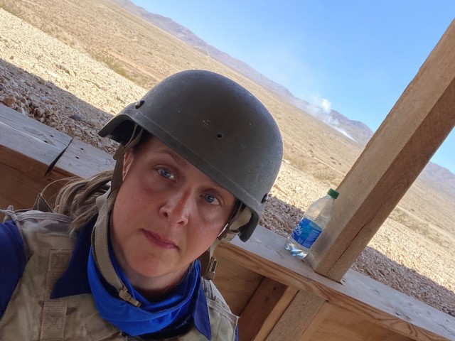 Amy Anton, Systems Readiness Directorate software airworthiness engineer for the U.S. Army Combat Capabilities Development Command Aviation & Missile Center, witnesses a live fire exercise during her visit to the National Training Center. 