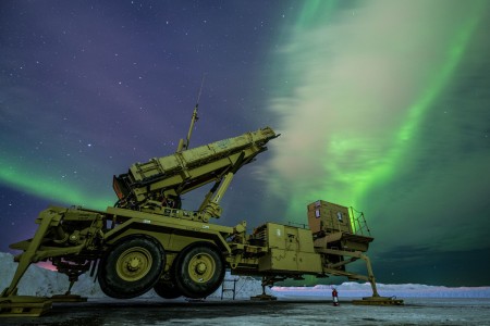 The Northern Lights glow behind an Army Patriot M903 launcher station at Eielson Air Force Base, Alaska, March 5, 2022, during exercise Arctic Edge 2022. The exercise is designed to provide realistic and effective training for participants using the premier training locations available throughout Alaska.