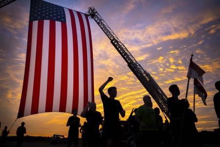 Soldiers cross the finish line during the installation’s 5K Patriot Day Run at Hunter Army Airfield, Ga., Sept. 8, 2022.