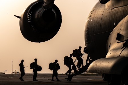 Soldiers board an Air Force C-17 Globemaster III during Operation Agile Spartan II at Ali Al Salem Air Base, Kuwait, March 16, 2022.