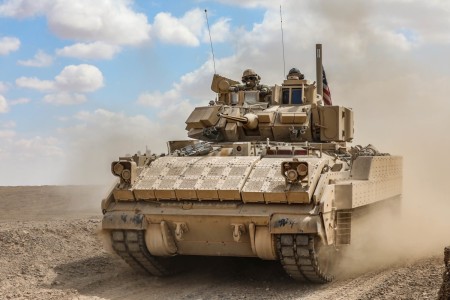 Soldiers operate a Bradley M2A3 Fighting Vehicle during a live-fire exercise with Syrian democratic forces and coalition partners in Syria, March 25, 2022.