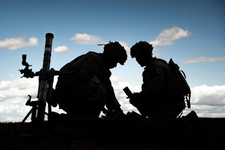 Army Spc. Brandon Almaguer, left, and Army Spc. Mattox Harrell, reorganize ammunition during a multinational live-fire exercise held at Rovaniemi Training Area, Finland, Aug. 11, 2022. Almaguer and Harrell are indirect-fire infantrymen assigned to the Viper Company, 1st Battalion, 26th Infantry Regiment, 2nd Brigade Combat Team, 101st Airborne Division.