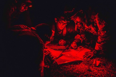 Members of 7th Special Forces Group (Airborne) conduct overnight land navigation during assessment training at Camp &#34;Bull&#34; Simons, Fla., April 26, 2022.