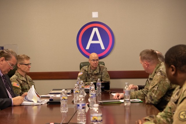 (At left) USASAC Commanding General Brig. Gen. Brad Nicholson talks security assistance with (center) Assistant Chief of Staff, Director of Operations (G3) for U.S. Army Central Brig. Gen. Henry Dixon at USARCENT headquarters, Shaw Air Force Base, South Carolina Nov. 29, 2022. USASAC, which leads the AMC Security Assistance Enterprise, works closely with USARCENT to execute Building Partner Capacity mission sets in support of U.S. and allied interests in the USCENTCOM area of responsibility.