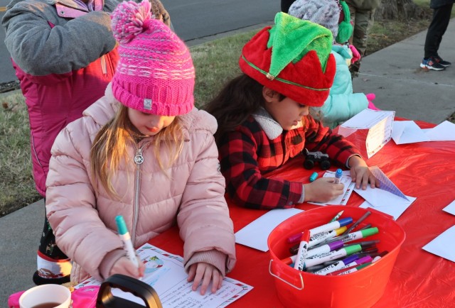 Children write letters to Santa at the annual Fort Knox Tree Lighting Ceremony Dec. 1, 2022.