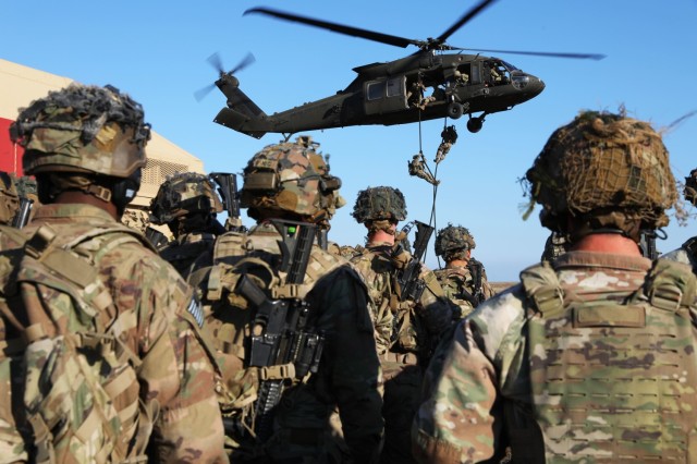 Soldiers assigned to the 1st Battalion, 502nd Infantry Regiment, 2nd Brigade Combat Team, 101st Airborne Division and 3rd Battalion, 501st Aviation Regiment, Combat Aviation Brigade, 1st Armored Division conduct fast rope insertion and extraction training at Mihail Kogălniceanu Airbase in Romania, Nov. 10, 2022. Soldiers continue to reinforce NATO’s eastern flank and reaffirm the commitment to the European continent.