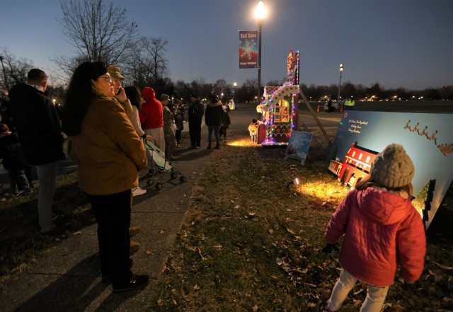 Fort Knox community members view the winners of the annual Holiday Card Contest, which were announced at the Tree Lighting Ceremony Dec. 1, 2022.