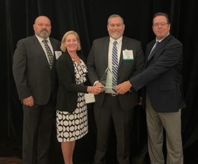 (Left to right) PdM BEC ABIS IT Specialist Jimmie Culley, DFSC BOD Deputy Assistant Director Amy Turlock, PdM BEC Forrest Church, and Leidos DoD ABIS PM David Jones accepted the award on behalf of the DoD ABIS BDMF team.