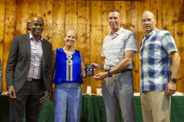 U.S. Army Maj. Gen. Thomas Spencer, right, and Command Sgt. Maj. Corey Cush, left, the commander and senior enlisted leader of the 42nd Infantry Division, present a plaque to Maj. Gen. Jami Shawley and U.S. Marine Corps Command Sgt. Maj. Frank Kammer, the commander and senior enlisted leader of Combined Joint Task Force – Horn of Africa, during the 1st Battalion, 69th Infantry Regiment’s annual Makin Diner, Nov. 26, 2022. The unit held the event at Camp Lemonnier, Djibouti. (U.S. Army photo by Staff Sgt. Alexander Rector)