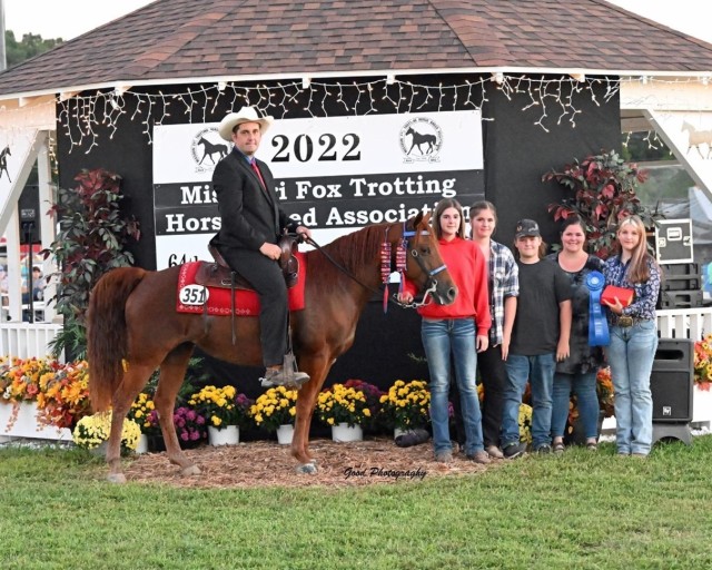 Fort Leonard Wood Directorate of Public Works Engineering Technician, Jerry Lee Rosa, known as J.R., poses with his family after winning the title of world champion during the Missouri Fox Trotting Horse Breed Association’s World Show and...
