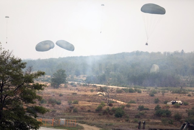 Members of the Texas Army National Guard with the 36th Sustainment Brigade conduct an airdrop exercise, the first sequential heavy-drop aerial resupply ever executed solely by Army National Guard and Air National Guard forces, during Northern Strike 21 at Camp Grayling, Michigan, on Aug. 4, 2021.