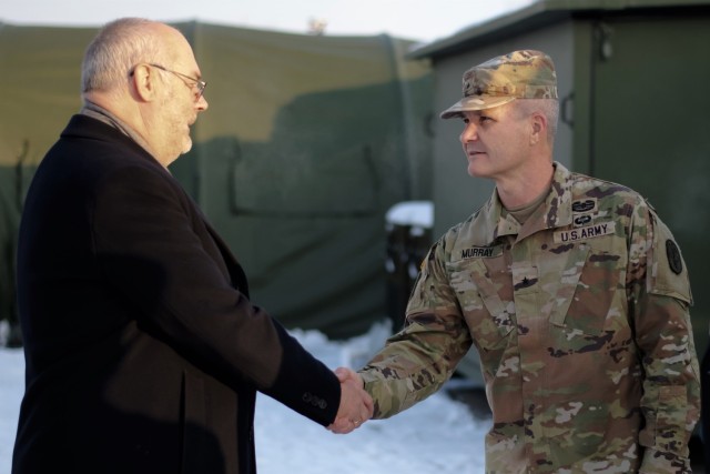 Brig. Gen. Clinton Murray, commanding general of Medical Readiness Command, Europe and command surgeon for U.S. Army Europe and Africa greets Estonian President, Alar Karis.