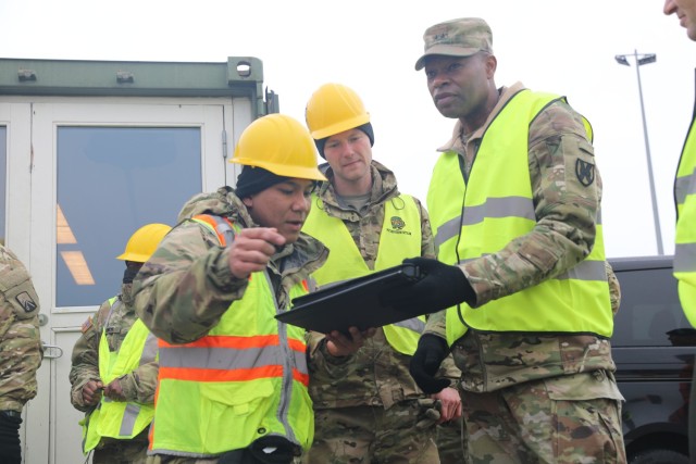 Sgt. Arnie Sampayan, 260th Transportation Detachment, 39th Transportation Battalion, 16th Sustainment Brigade, left, explains how the Distributional Retrograde Adaptive Planning and Execution Management Program is tracking all of the equipment being offloaded from the port in Esbjerg, Denmark, on April 6, 2022, to Capt. Zachary Zanetti, commander, 260th Transportation Detachment, 39th Transportation Battalion, 16th Sustainment Brigade, center, and Maj. Gen. James M. Smith, commander, 21st Theater Sustainment Command. The ability to deliver 3/4 ABCT equipment through port facilities in Alexandroupoli, Greece, Vlissingen, Netherlands, and Esbjerg, Denmark, demonstrates the strong relationships the U.S. Army has with allies and commercial partners in
ports across Europe. 