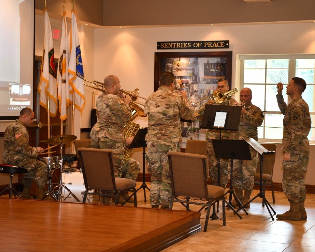 The Puerto Rico Army National Guard 248th Army Band Hellfighters Brass Quintet under the direction of Staff Sgt. Anthony Martinez provided the official music for the Fort Buchanan Garrison Change of Command Ceremony, seen here playing the Army Song.