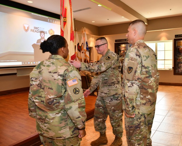 Incoming Fort Buchanan Garrison Commander, Col. Charles N. Moulton receives virtually, the Garrison Colors from Installation Management Command (IMCOM) Readiness Director Brenda Lee McCullough, symbolizing the transfer of authority and charging him with the responsibility for the unit as its New Garrison Commander. Also passed, is the loyalty of Soldiers and Civilians to the New Garrison Commander.