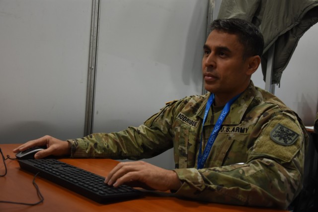 Lt. Col. Kerman Rodriguez, NRDC-Spain G1, responds to a request for information during Exercise Loyal Leda 2022 in Bydgoszcz, Poland. The 10-day combat readiness evaluation exercise hosted at the NATO Joint Force Training Centre was an Allied Land Command-sponsored, land domain, tactical level, virtual command post exercise held from Nov. 30 to Dec. 9.