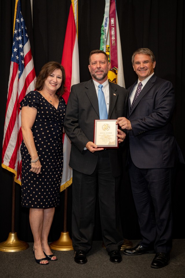 AUSA Huntsville-Redstone Chapter President Rhonda Sutton and DEVCOM AvMC Director Jeff Langhout recognize Stan Sherrod at the 2022 AUSA Civilian of the Year Awards Dinner.