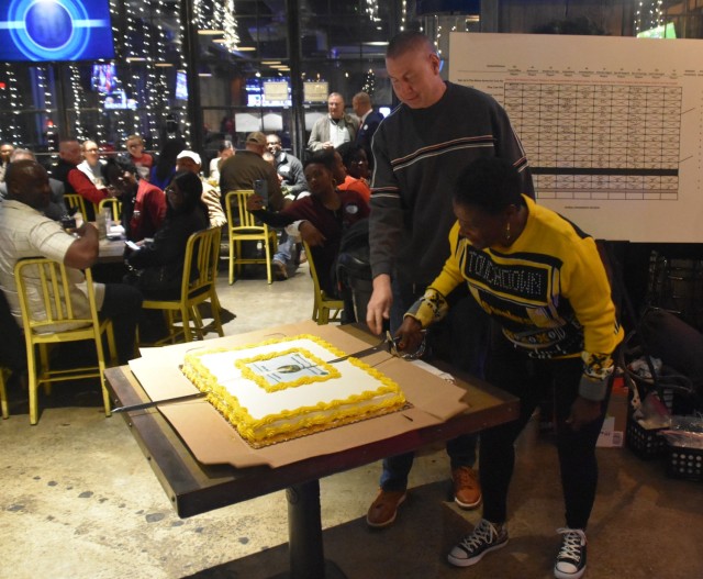 U.S. Army Lt. Gen. Donna W. Martin, the 67th Inspector General, right, and Sgt. Maj. Larry Orvis, the Inspector General Sergeant Major, cut the cake Dec. 3, 2022, in Arlington, Virginia, to mark the 245th birthday of the Army Inspector General...