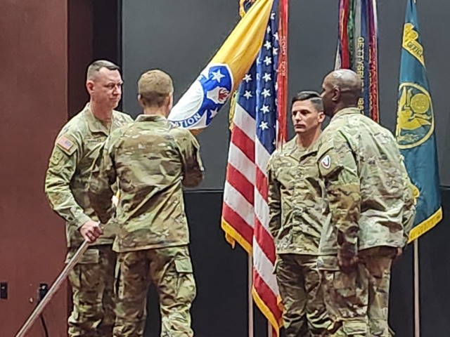 (From right) USASAC’s outgoing Command Sgt. Maj. Sean Rice, Commanding General Brig. Gen. Brad Nicholson and incoming Command Sgt. Maj. Stephen Burnley during a Dec.16, 2022 change of responsibility ceremony at Redstone Arsenal’s Bob Jones Auditorium