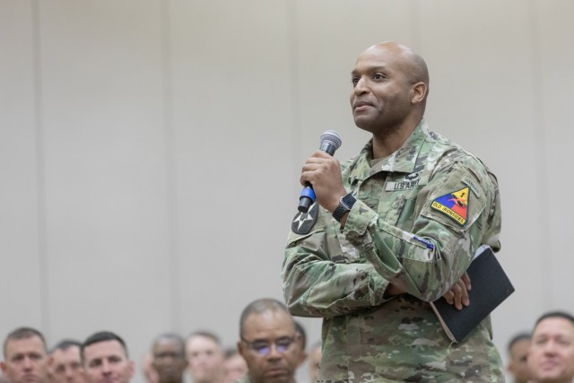 Col. Thurman McKenzie, the 1st Armored Division Artillery commander, asks a question during an open forum session at the 2022 Iron Summit at the El Paso Convention Center, in El Paso, Texas, Dec. 13, 2022. Iron Summit gathered 1st AD leaders and partner unit leaders ranging from the company level to the brigade level, as well as local and regional civilian leaders for the two-day leadership forum and intra-division dialogue on organizational leadership, building cohesive teams, and caring for people.