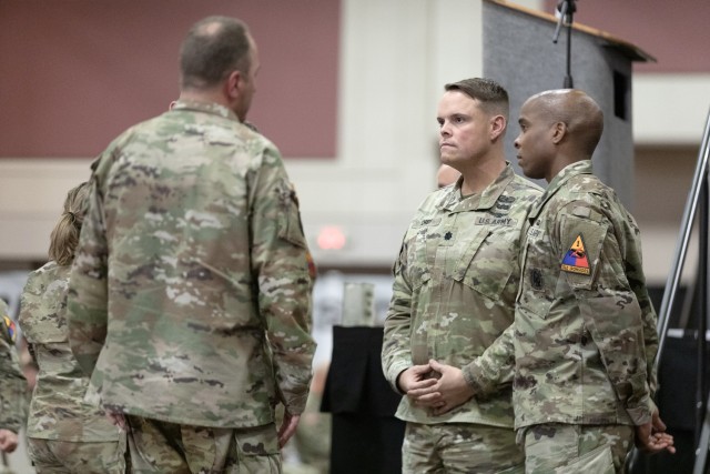 Soldiers speak with Maj. Gen. James P. Isenhower III (left), the 1st Armored Division and Fort Bliss commanding general, at Iron Summit in El Paso, Texas, Dec. 13, 2022. Iron Summit was a two-day conference, hosted by the 1st AD, bringing together leaders from Fort Bliss to develop leader proficiency.