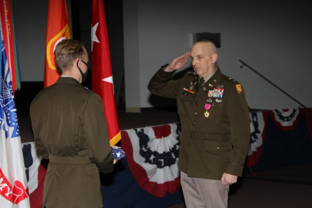 Col. Scott Bird, NETCOM Deputy Commander for Operations, (DCO) salutes the U.S. Flag
