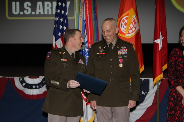 Col. Scott Bird, NETCOM Deputy Commander for Operations, (DCO) shares a has a word with Maj. Gen. Eu