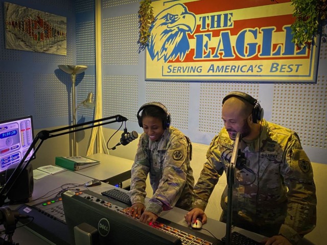 Staff Sgt. Sharifa Newton and Staff Sgt. Page Sevilla work the board at AFN Vicenza during a recent morning show. Their broadcasts, now heard at 105.3 FM and on the AFN Go app, offer local news and information, setting them apart from other music and entertainment programs. 