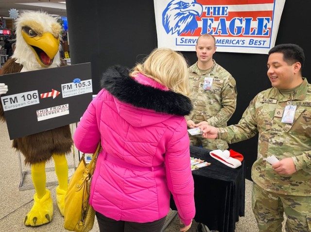 Soldiers from AFN Vicenza share the news with community members at the Caserma Ederle post exchange that AFN The Eagle has a new frequency, 105.3 FM.