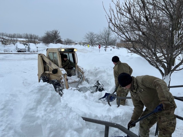 New York Army National Guard Soldiers assigned to the 827th Engineer Battalion clear snow at the Cheekowaga Senior Citizens Center in Cheektowaga, New York on Dec. 216, 2022, as part of the New York state government response to a major snowstorm. The New York National Guard deployed 433 Soldiers to western New York following the snow storm which hit the region over the Christmas weekend.