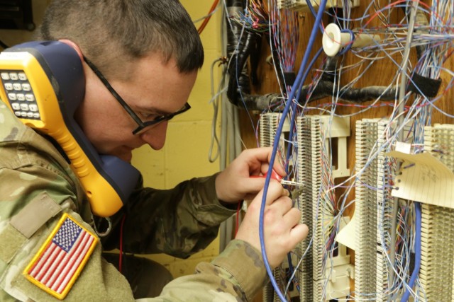 Spc. Kaden Scherger, with the 1137th Signal Company TIN-E (Tactical Installation and Networking-Enhanced), tests network connections during an infrastructure improvement project April 26, 2022, at Rickenbacker Air National Guard Base in Columbus, Ohio. The 1137th&#39;s primary mission to install and maintain computer network infrastructure. 