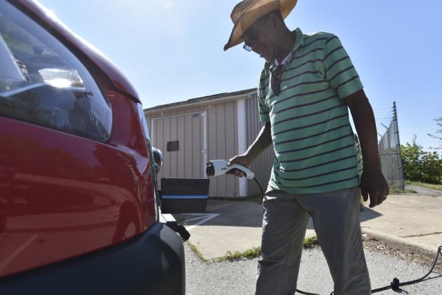 Michael Bagby, a driver with the Logistics Readiness Center, plugs the power cable into one of Fort Leonard Wood’s new electric vehicles July 27 at the Transportation Motor Pool. The new EVs here are part of the Army’s latest directive of...