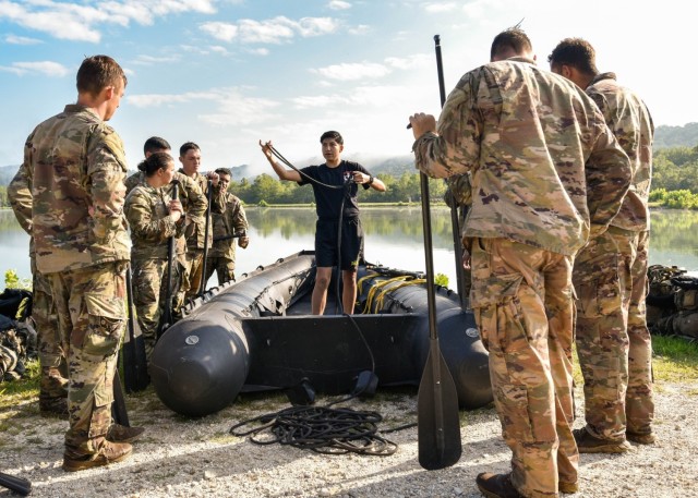 Sapper Leader Course instructor Staff Sgt. Ariana Sanchez instructs students during the boat rigging event Aug. 23 at Training Area 250. Sanchez became an SLC instructor in 2021, making her the first female Soldier to hold the position.
