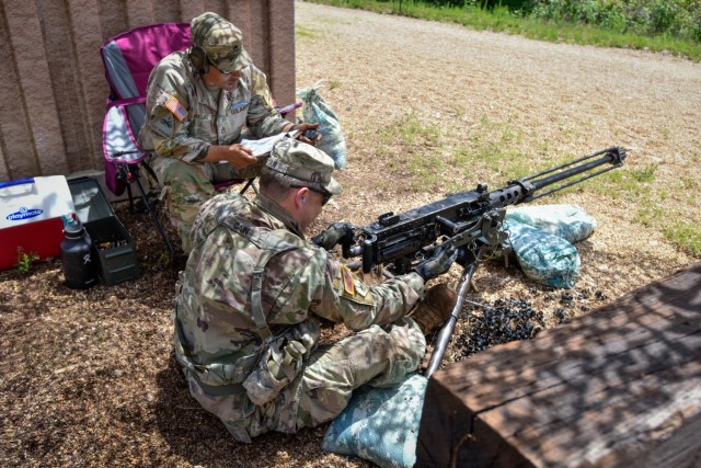 2nd Lt. Adam Cain, a platoon leader with Company A, 31st Engineer Battalion, performs a functions check on the M2 .50 Caliber machine gun, while Sgt. 1st Class David Riojas, a platoon leader with Company A, 1st Battalion, 18th Infantry Regiment,...