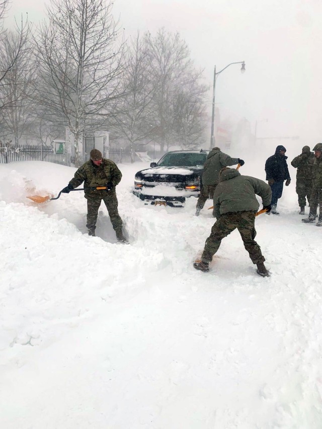 New York Air National Guard Airmen assigned to the 107th Attack Wing at Niagara Falls Air Reserve Station assist motorists stuck in high snow drifts near Buffalo, New York, Dec. 25, 2022.