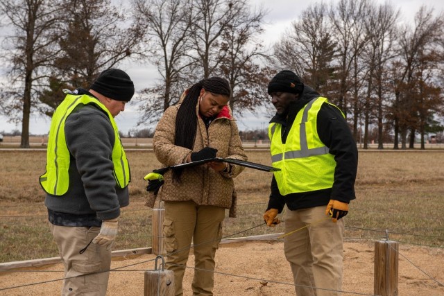 From left: Craig Reeves, Breanna Anderson and Anthony Riley, with Fort Leonard Wood’s Garrison Safety Office, review their findings Dec. 15 after inspecting part of an obstacle course used for training National Guard service members at Camp...