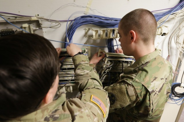 Soldiers with the 1137th Signal Company remove old network cabling to clear space for new network equipment racks during an infrastructure improvement project April 26, 2022, at Rickenbacker Air National Guard Base, in Columbus, Ohio. The 1137th is a new unit that stood up in 2019, with a primary mission to install and maintain computer network infrastructure.