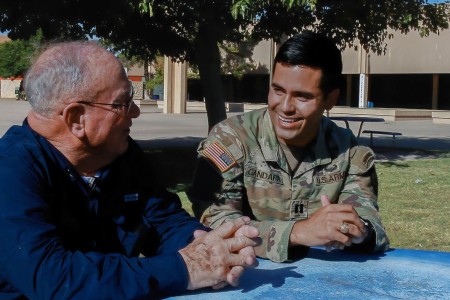 Retired U.S. Army Maj. Joseph Cancellare, the former Senior Army Instructor at Bowie High School, and U.S. Army Capt. Saul Gandara, the company commander assigned to Headquarters and Headquarters Company, 3rd Infantry Brigade Combat Team, 25th Infantry Division, share a laugh during an interview about their involvement with the Bowie High School Junior Reserve Officers&#39; Training Corps program Oct. 20, 2022 in El Paso, Texas. The two are now focused on molding students into better citizens and inspiring them to embark on paths that leave ripples of forward mobility in the community.