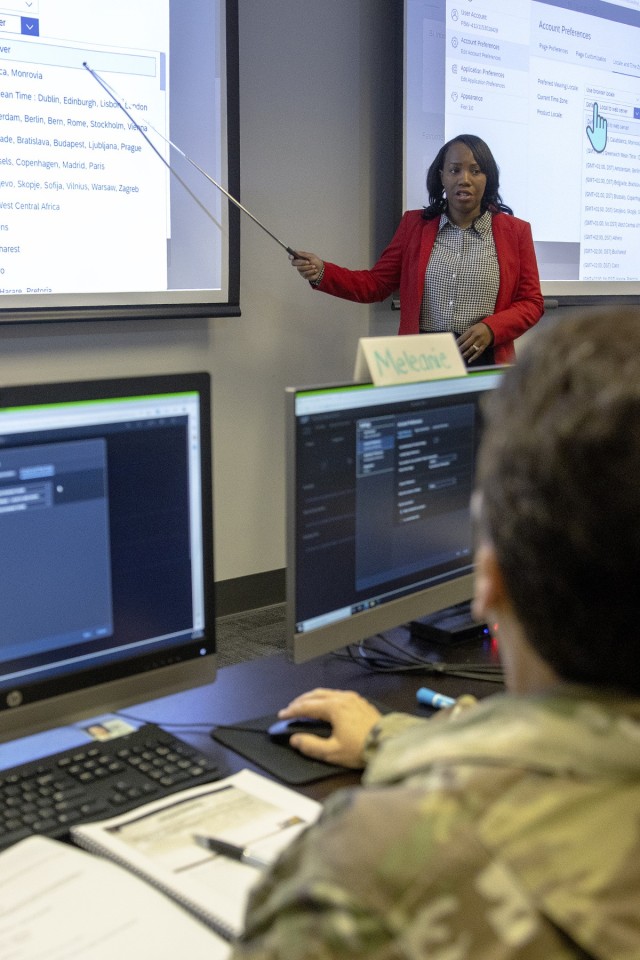 Talonda Mott, U.S. Army Financial Management Command System Support Operations financial systems instructor, explains various portions of SAP BI Business Objects 4.3 to Sgt. 1st Class Julie Kraemer, 84th Training Command budget analyst, at the Maj. Gen. Emmett J. Bean Federal Center in Indianapolis Dec. 12, 2022. USAFMCOM now offers an in-residence, 3-day class on SAP BI Business Objects 4.3 to help financial and resource managers leverage a modernized system to provide critical financial data to commanders while dramatically cutting their time to build financial reports. (U.S. Army photo by Mark R. W. Orders-Woempner)