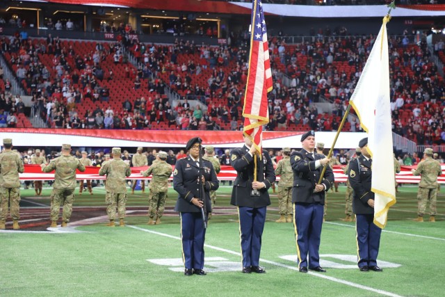 ATLANTA - Members of the Western Hemisphere Institute for Security Cooperation (WHINSEC) combined forces with Fort Gordon Initial Entry Training Soldiers from 15th Signal Brigade as they presented the National Colors during the Arizona - Atlanta NFL game on Jan 1 at the Mercedes Benz Stadium. U.S. Army National Guard photo by 1st Lt. Jasmine Mathews.