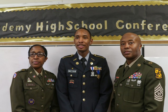Col. Kandace Daffin, 2nd Brigade Army ROTC commander, Army JROTC Cadet Kaheem Bailey-Taylor and Command Sgt. Maj. Jacoby Gadson, 2nd Brigade Army ROTC Command Sgt. Maj. pose for a photo following the award ceremony for the Medal of Heroism at Philadelphia Military Academy on January 6, 2023, in Philadelphia, PA. This award is the highest Department of the Army medal exclusively awarded to Army ROTC and JROTC Cadets. The medal is presented to those who perform an act of heroism where the &#34;acceptance of danger and extraordinary responsibilities, exemplifying praiseworthy fortitude and courage” are involved.