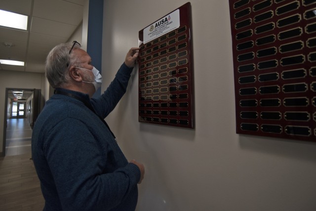 Carl Norman, Fort Leonard Wood Blood Donor Center recruiter, prepares to update the new 100-Donor Club board Tuesday in the donor center’s lobby. The newest members of the club – made up of organizations that provide 100 or more eligible...