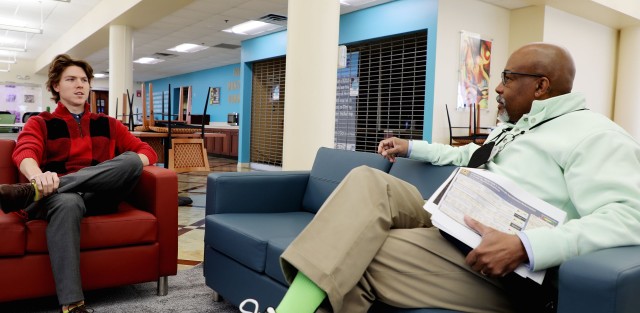 Zack Rynar (left), an ammunition acquisition specialist at the Joint Munitions Command, and Stoney Ross, the JMC’s director of equal employment opportunity, chat inside the command’s headquarters at the Rock Island Arsenal.